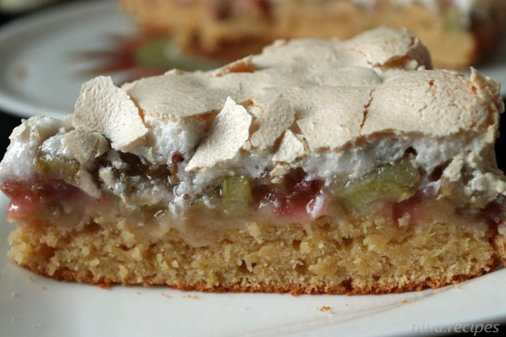 Piece of a delicious Rhubarb Cake with sour cream or joghurt and Meringue Topping