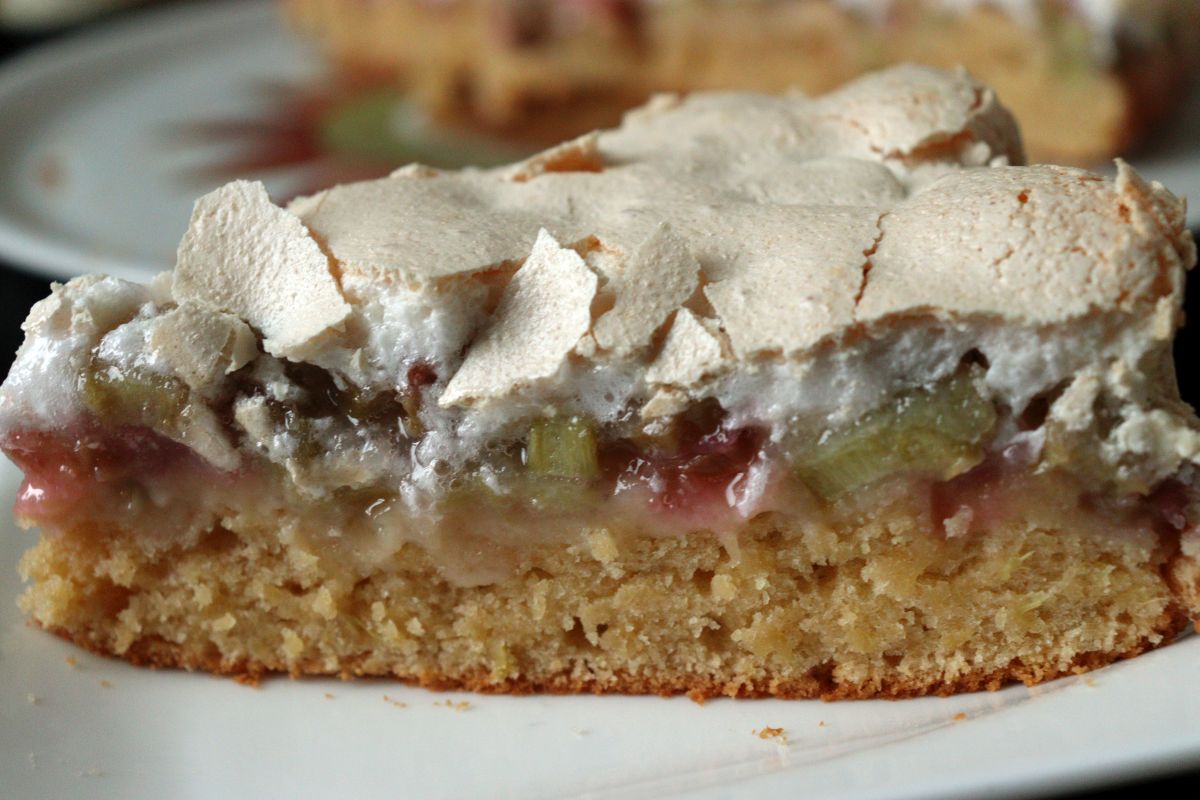 Piece of a delicious Rhubarb Cake with sour cream or joghurt and Meringue Topping