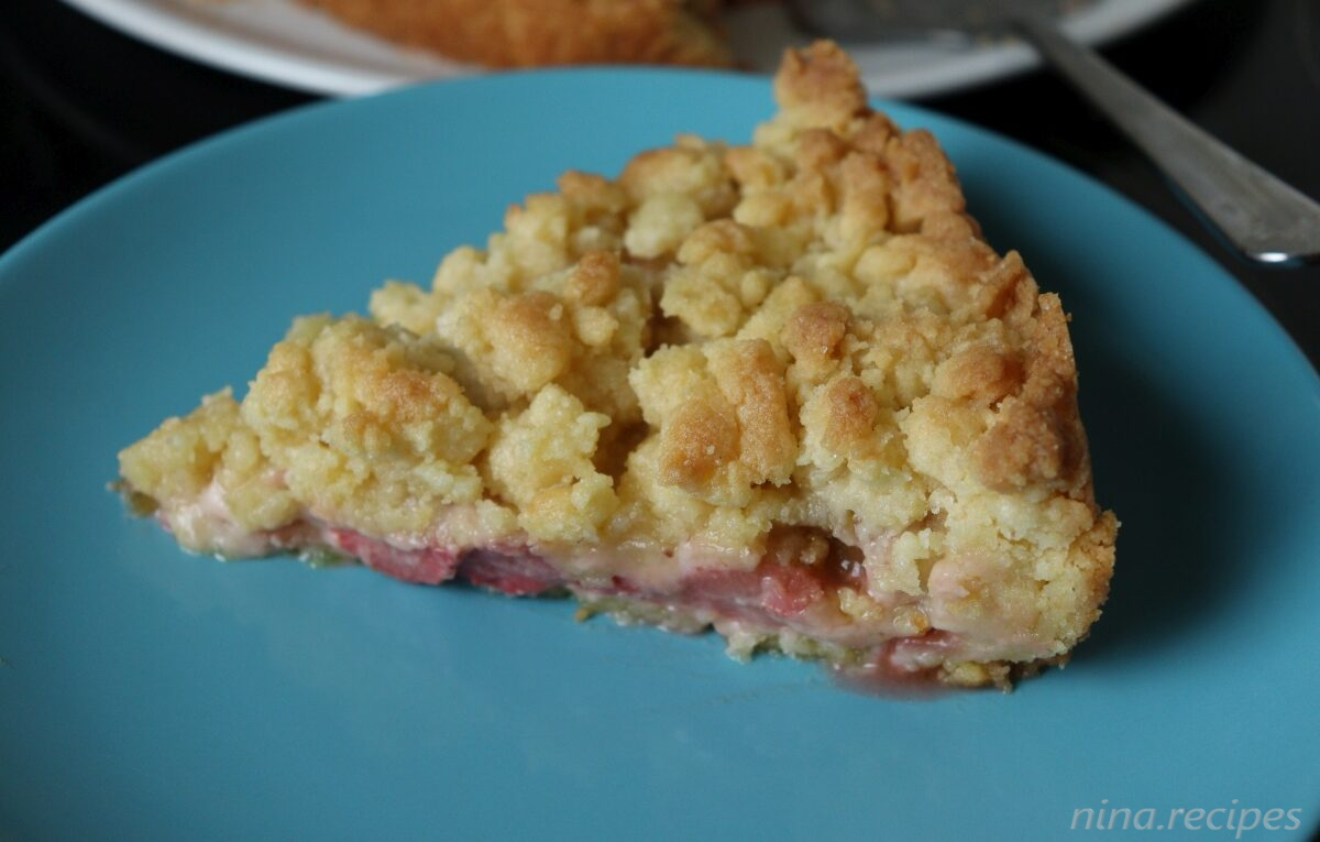 Piece of Strawberry Rhubarb Pie with crumble topping