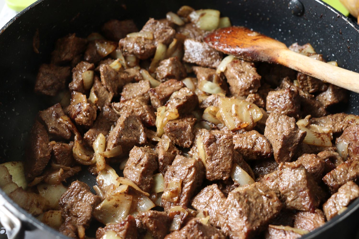 Browning the veal (beef) and the onions in a pan for Hungarian Goulash