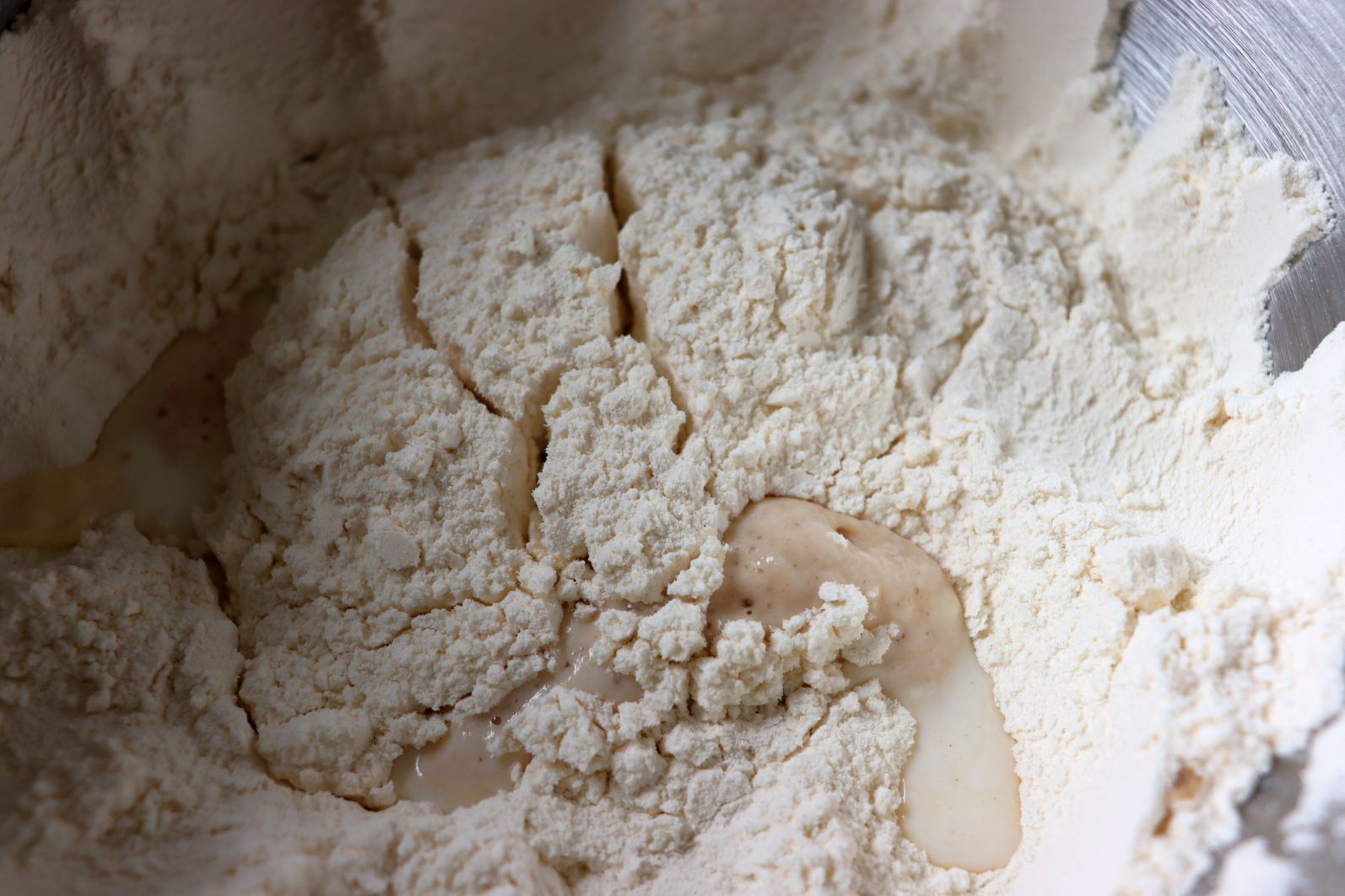 Yeast dough preparation: flour, salt, milk, sugar and yeast
