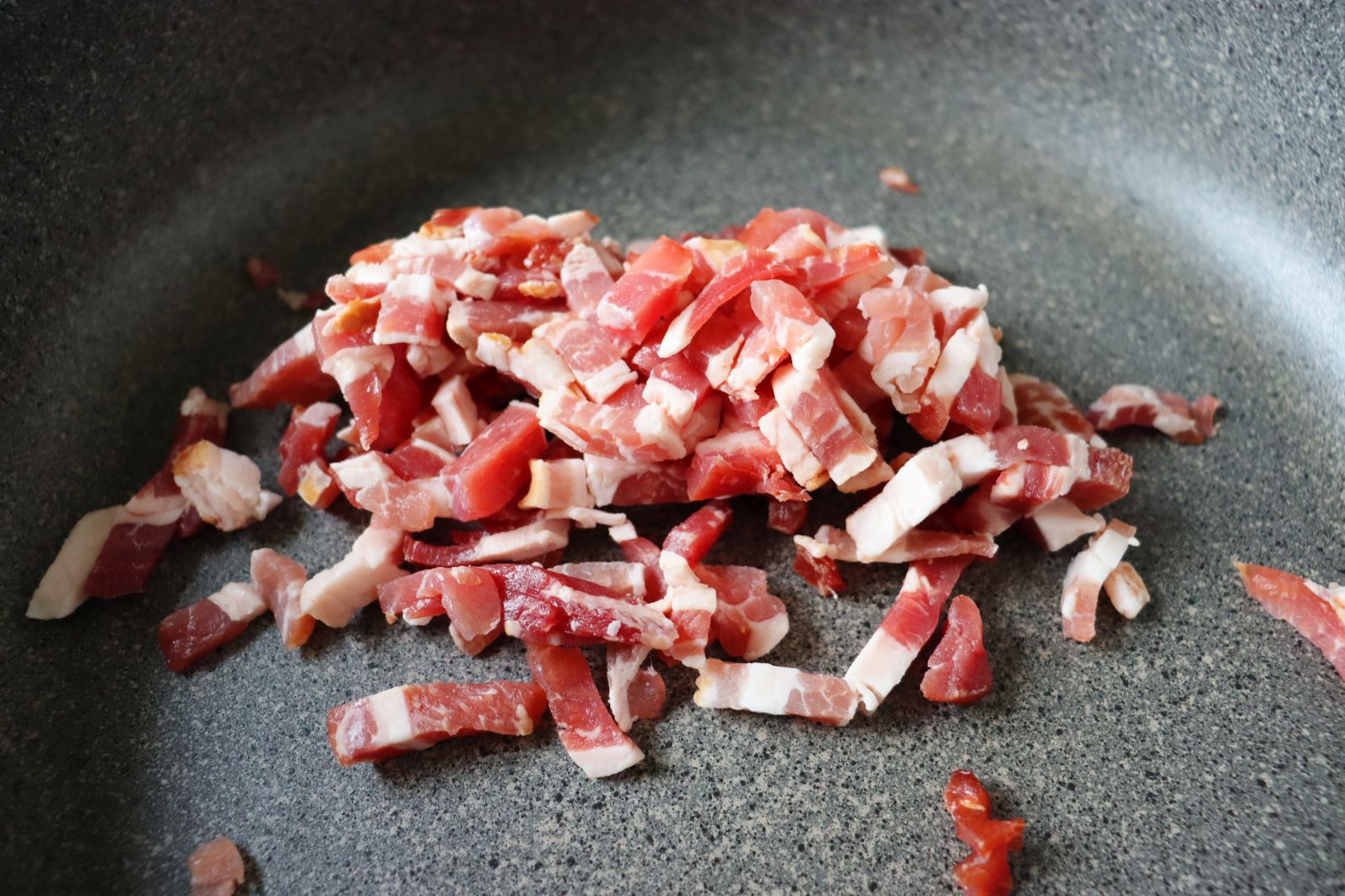 Raw bacon to be sautéed